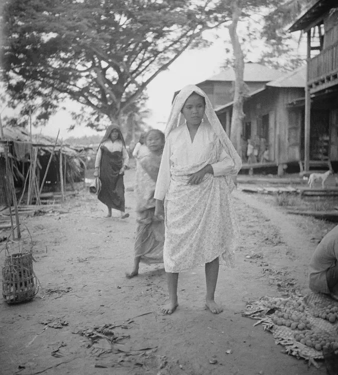 September 11, 1933. Dulauan [Datu Piang], Cotabato Prov. [Maguindanao province] Mora Muslim women on village street.