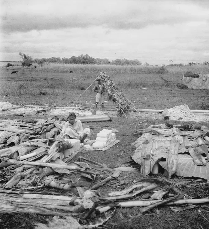 Dec. 1 '34. Making cylinders of white clay. 'Putting Lupa' Pansol. Dalihican [Domacaa], Tayabas [Quezon province]; Pansol, and Forestry, Laguna.