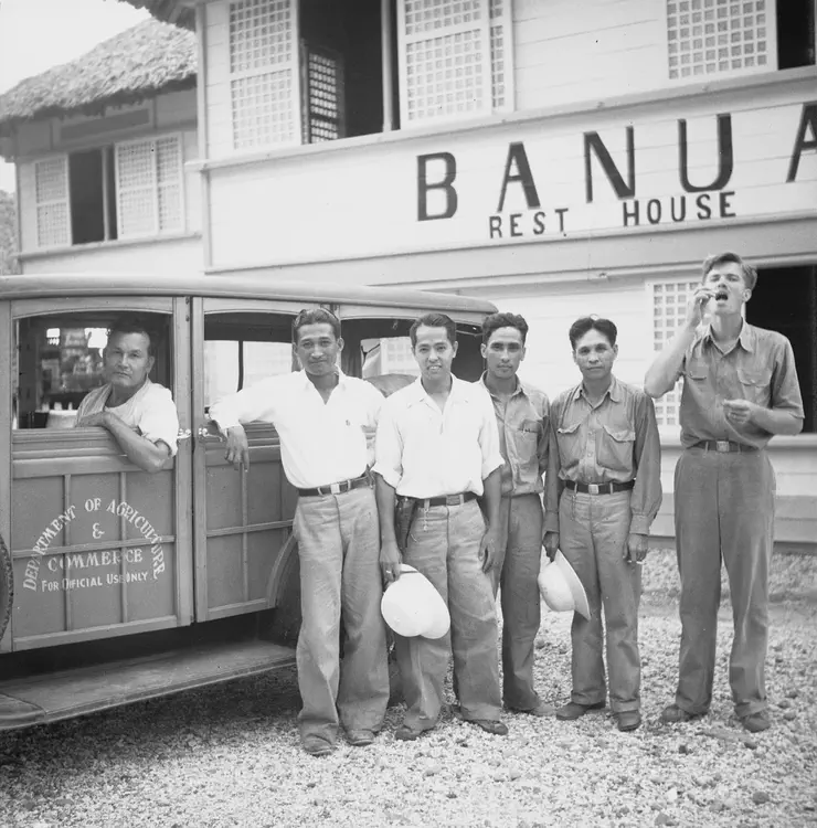 Banua Rest House and group of men with Department of Agriculture and Commerce car. Pasaleng Bay, Pancian Valley, Banua; Ilocos Norte Province. May 24 '35. Banua rest house. 5.6 1/25