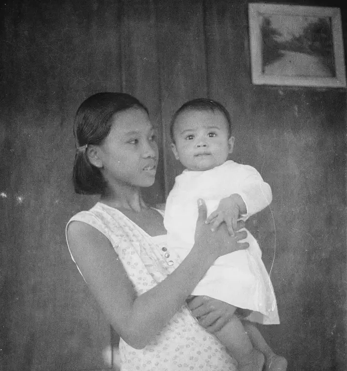 Cabanatuan, NE, 1933. 'Cabanatuan & Bongabong Road, Nueva Ecija. Dec. 30 '33. [woman holding] Manuel Garcia, Jr.